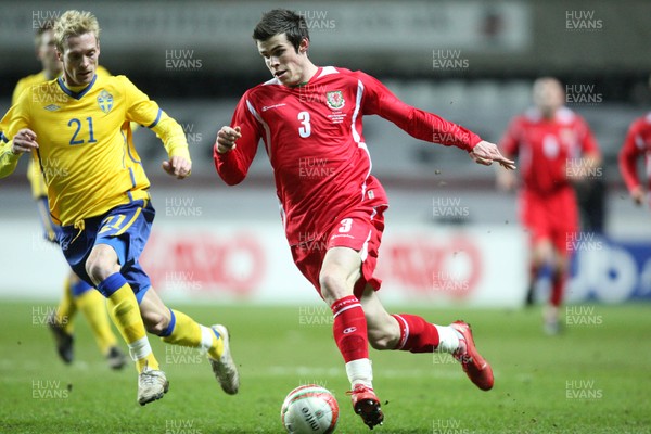 03.03.10 ... Wales v Sweden, Friendly International, Swansea -  Wales' Gareth Bale takes on Sweden's Christian Wilhelmsson  
