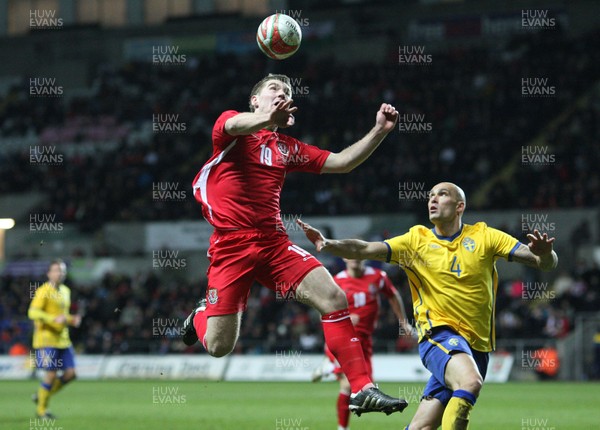 03.03.10 ... Wales v Sweden, Friendly International, Swansea -  Wales' Sam Vokes beats Sweden's Daniel Majstorovic to the ball 