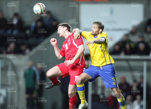 03.03.10 ... Wales v Sweden, Friendly International, Swansea -  Wales' Sam Vokes and Sweden's Olof Mellberg compete for the ball 