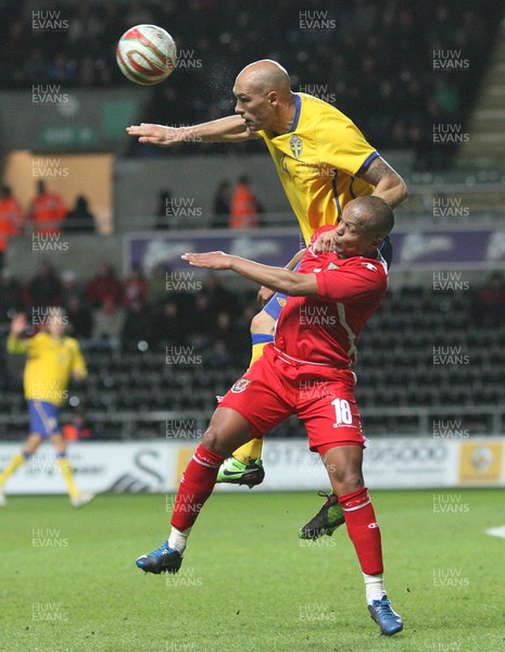 03.03.10 ... Wales v Sweden, Friendly International, Swansea -  Sweden's Daniel Majstorovic climbs above Wales' Robert Earnshaw  