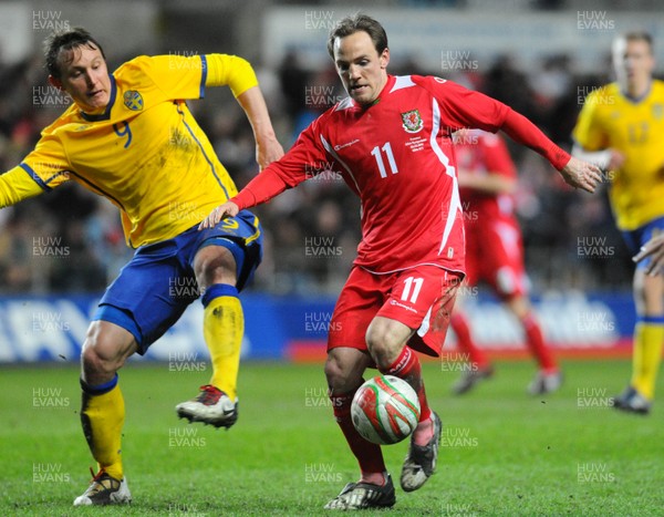 03.03.10 - International Football Friendly, Wales v Sweden Wales' David Vaughan and Sweden's Kim Kallstrom compete 