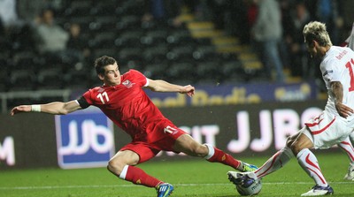 07.10.11 -  Wales v Switzerland, Euro 2012 Qualifying Match -  Wales' Gareth Bale takes on Switzerland's Valon Behrami  