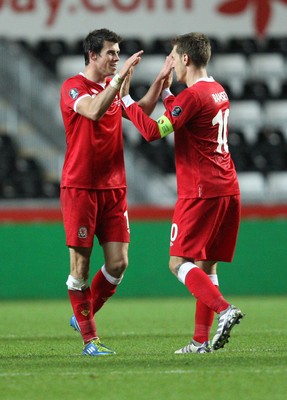 07.10.11 -  Wales v Switzerland, Euro 2012 Qualifying Match -  Wales' Aaron Ramsey and Gareth Bale celebrate at the end of the match 