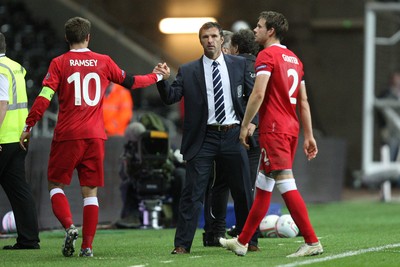07.10.11 -  Wales v Switzerland, Euro 2012 Qualifying Match -  Wales' Aaron Ramsey is congratulated by manager gary Speed as he leaves the pitch  