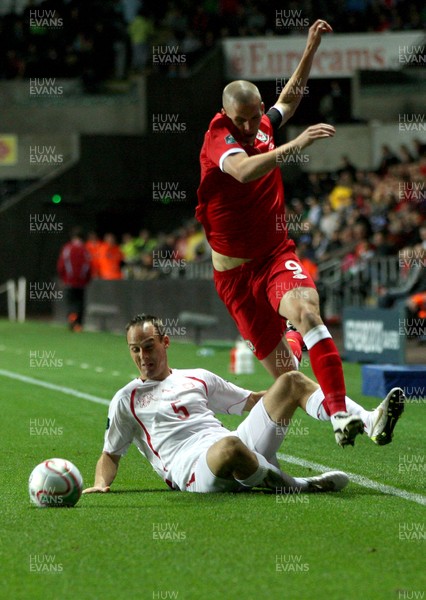 07.10.11 -  Wales v Switzerland, Euro 2012 Qualifying Match -  Wales' Steve Morrison  is brought down by Switzerland's Steve Von Bergen 