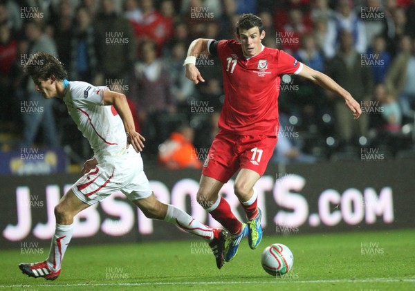 07.10.11 -  Wales v Switzerland, Euro 2012 Qualifying Match -  Wales' Gareth Bale takes on Switzerland's Timm Klose  
