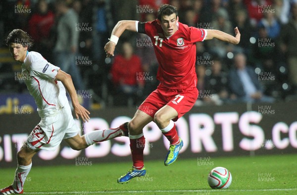 07.10.11 -  Wales v Switzerland, Euro 2012 Qualifying Match -  Wales' Gareth Bale takes on Switzerland's Timm Klose  