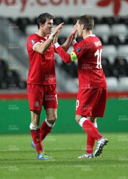 07.10.11 -  Wales v Switzerland, Euro 2012 Qualifying Match -  Wales' Aaron Ramsey and Gareth Bale celebrate at the end of the match 