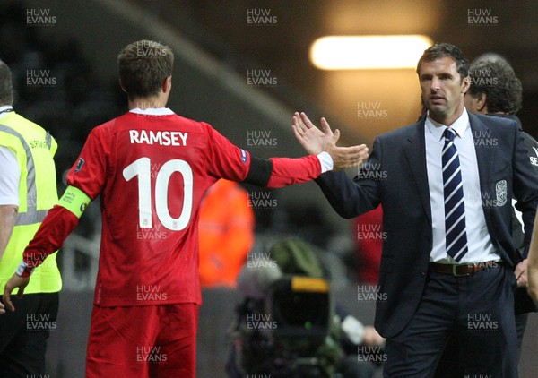 07.10.11 -  Wales v Switzerland, Euro 2012 Qualifying Match -  Wales' Aaron Ramsey is congratulated by manager gary Speed as he leaves the pitch  