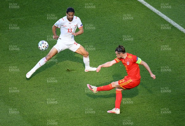 120621 - Wales v Switzerland, European Championship - Group A - Gareth Bale of Wales passes past Ricardo Rodriguez of Switzerland