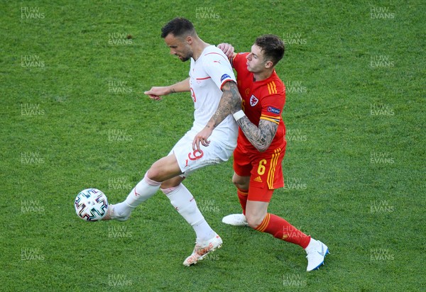 120621 - Wales v Switzerland, European Championship - Group A - Haris Seferovic of Switzerland is tackled by Joe Rodon of Wales