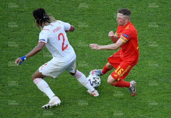 120621 - Wales v Switzerland, European Championship - Group A - Joe Morrell of Wales is tackled by Kevin Mbabu of Switzerland