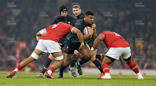 171118 - Wales v Tonga - Under Armour Series - Leon Brown of Wales is tackled by Sione Vailanu and Ma'afu Fia of Tonga