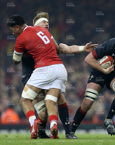 171118 - Wales v Tonga - Under Armour Series - Dan Faleafa of Tonga takes out Aaron Wainwright of Wales as Adam Beard goes past with the ball