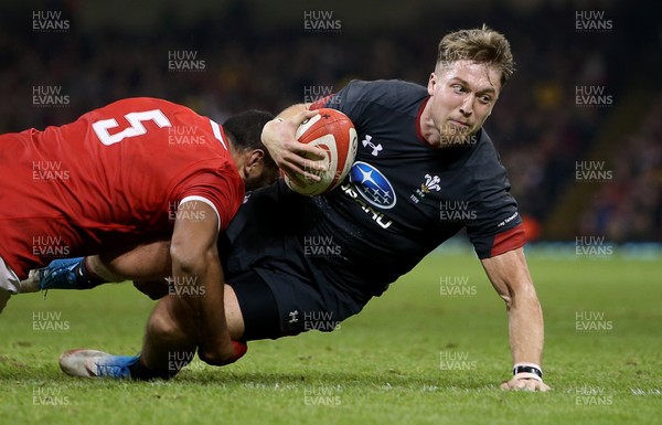 171118 - Wales v Tonga - Under Armour Series - Tyler Morgan of Wales is tackled by Sitiveni Mafi of Tonga