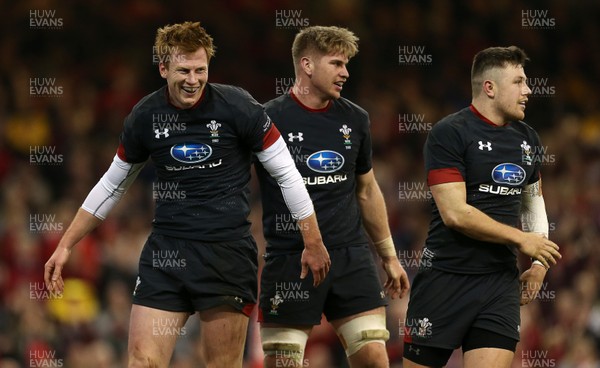 171118 - Wales v Tonga - Under Armour Series - Rhys Patchell of Wales celebrates scoring a try with Aaron Wainwright and Steff Evans