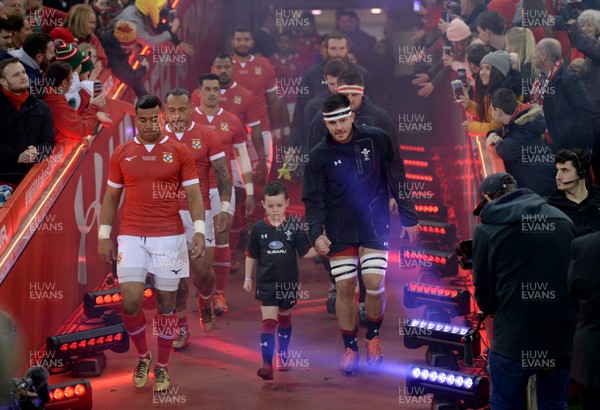 171118 - Wales v Tonga - Under Armour Series -  Siale Piutau of Tonga and Ellis Jenkins of Wales lead their teams out