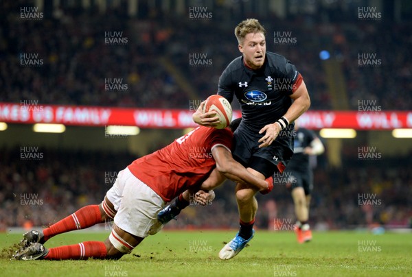 171118 - Wales v Tonga - Under Armour Series -  Tyler Morgan of Wales is tackled by Sitiveni Mafi of Tonga