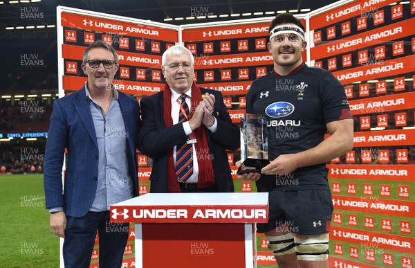 171118 - Wales v Tonga - Under Armour Series - Ellis Jenkins of Wales receives the winning trophy from Mike Dodds of Under Armour (left) and WRU President Dennis Gethin