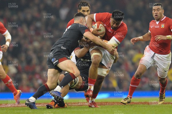 171118 - Wales v Tonga - Under Armour Series - Dan Faleafa of Tonga  is tackled by Tomos Williams of Wales 