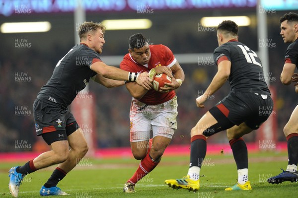 171118 - Wales v Tonga - Under Armour Series - Siale Piutau of Tonga  is tackled by Tyler Morgan of Wales 