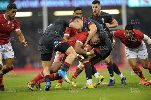 171118 - Wales v Tonga - Under Armour Series - Siale Piutau of Tonga is tackled by Tyler Morgan of Wales and Owen Watkin of Wales 