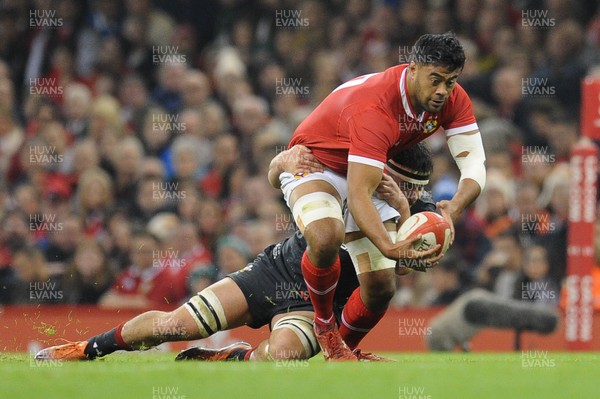 171118 - Wales v Tonga - Under Armour Series - Mike Faleafa of Tonga is tackled by Ellis Jenkins of Wales 