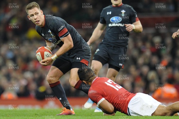 171118 - Wales v Tonga - Under Armour Series - Steff Evans of Wales is tackled by Alaska Taufa of Tonga 
