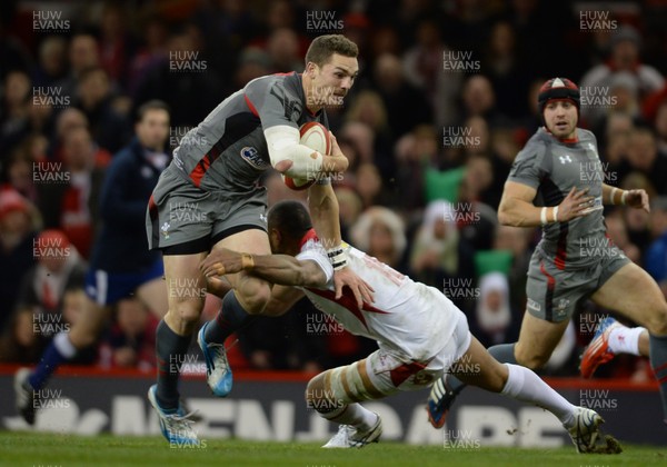 221113 - Wales Tonga - Dove Men Series -George North of Wales is tackled by Vunga Lilo of Tonga