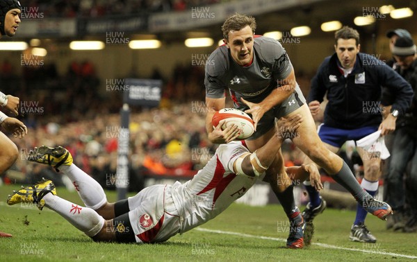 221113 - Wales v Tonga - Dove Men Series 2013 - Ashley Beck of Wales scores the second try for Wales whilst being tackled by Vaea Taione of Tonga