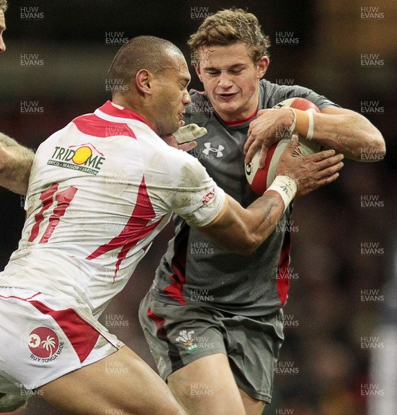 221113 - Wales v Tonga - Dove Men Series 2013 - Hallam Amos of Wales is tackled by Will Helu of Tonga