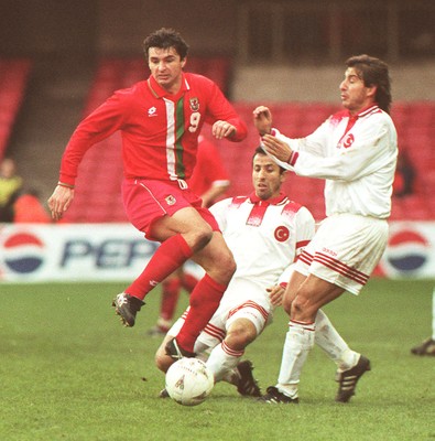 141296 - Wales v Turkey - Gary Speed of Wales is tackled by Recep Cetin and Ilker Yapcioglu