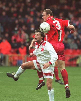 141296 - Wales v Turkey - Robert Page of Wales rises above Tugay Kerimoglu