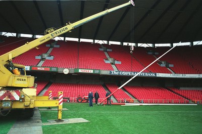141296 - Wales v Turkey - Ground staff put rugby posts back into position following the conclusion of the match ready for Wales v South Africa the next day