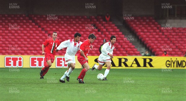 141296 - Wales v Turkey - Vinnie Jones (left) and Mark Hughes of Wales in action at Cardiff Arms Park in front of a small crowd