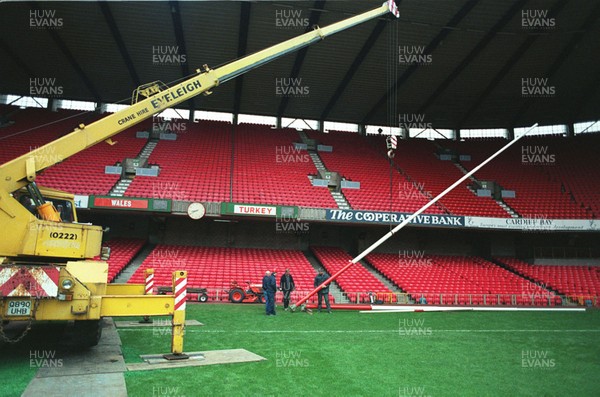 141296 - Wales v Turkey - Ground staff put rugby posts back into position following the conclusion of the match ready for Wales v South Africa the next day
