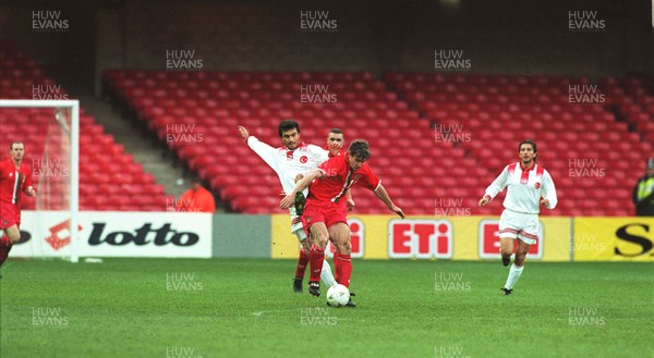 141296 - Wales v Turkey - Mark Hughes of Wales in action at Cardiff Arms Park in front of a small crowd