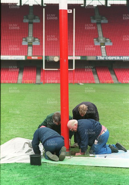141296 - Wales v Turkey - Ground staff put rugby posts back into position following the conclusion of the match ready for Wales v South Africa the next day