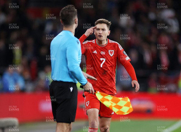 211123 - Wales v Turkey - UEFA Euro 2024 Qualifier - David Brooks of Wales questions the linesman