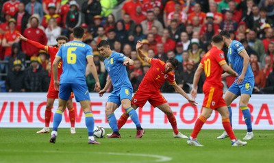 050622 -  Wales v Ukraine, World Cup Qualifying Play Off Final - Ruslan Malinovskyi of Ukraine is tackled by Joe Allen of Wales