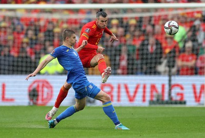 050622 -  Wales v Ukraine, World Cup Qualifying Play Off Final - Gareth Bale of Wales is challenged by Vitalii Mykolenko of Ukraine