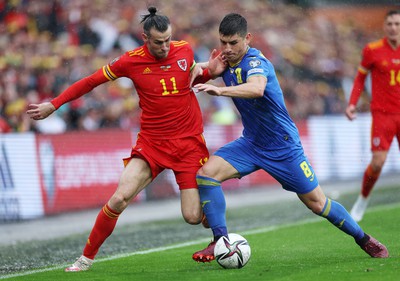 050622 -  Wales v Ukraine, World Cup Qualifying Play Off Final - Gareth Bale of Wales is challenged by Ruslan Malinovskyi of Ukraine