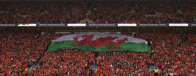 050622 -  Wales v Ukraine, World Cup Qualifying Play Off Final - A giant Welsh flag is passed up the stand ahead of the match