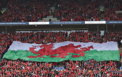 050622 -  Wales v Ukraine, World Cup Qualifying Play Off Final - A giant Welsh flag is passed up the stand ahead of the match