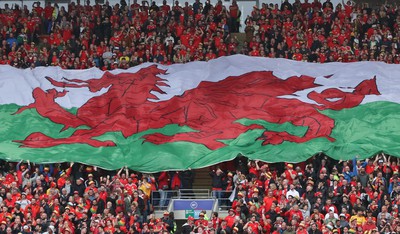 050622 -  Wales v Ukraine, World Cup Qualifying Play Off Final - A giant Welsh flag is passed up the stand ahead of the match