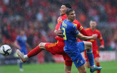 050622 -  Wales v Ukraine, World Cup Qualifying Play Off Final - Illia Zabarnyi of Ukraine and Kieffer Moore of Wales compete for the ball