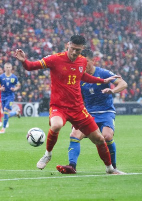 050622 -  Wales v Ukraine, World Cup Qualifying Play Off Final - Kieffer Moore of Wales holds off Ruslan Malinovskyi of Ukraine