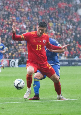 050622 -  Wales v Ukraine, World Cup Qualifying Play Off Final - Kieffer Moore of Wales holds off Ruslan Malinovskyi of Ukraine