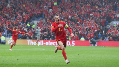 050622 -  Wales v Ukraine, World Cup Qualifying Play Off Final - Gareth Bale of Wales celebrates after his free kick is deflected into the Ukraine net to score goal