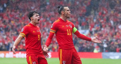 050622 -  Wales v Ukraine, World Cup Qualifying Play Off Final - Gareth Bale of Wales celebrates with Neco Williams of Wales after his free kick is deflected into the Ukraine net to score goal